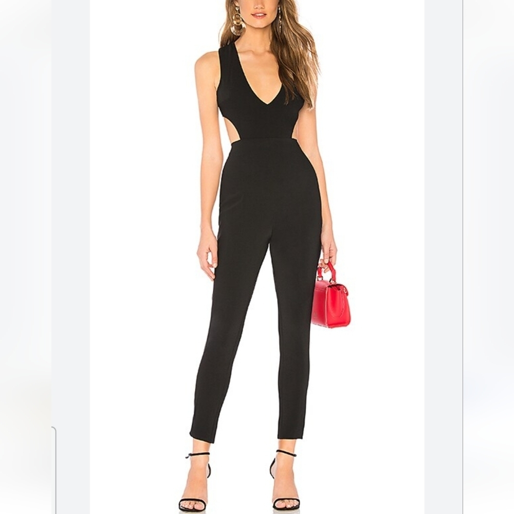 Rolla coster black jumpsuit size M opening on the sides zipper at the‎ back